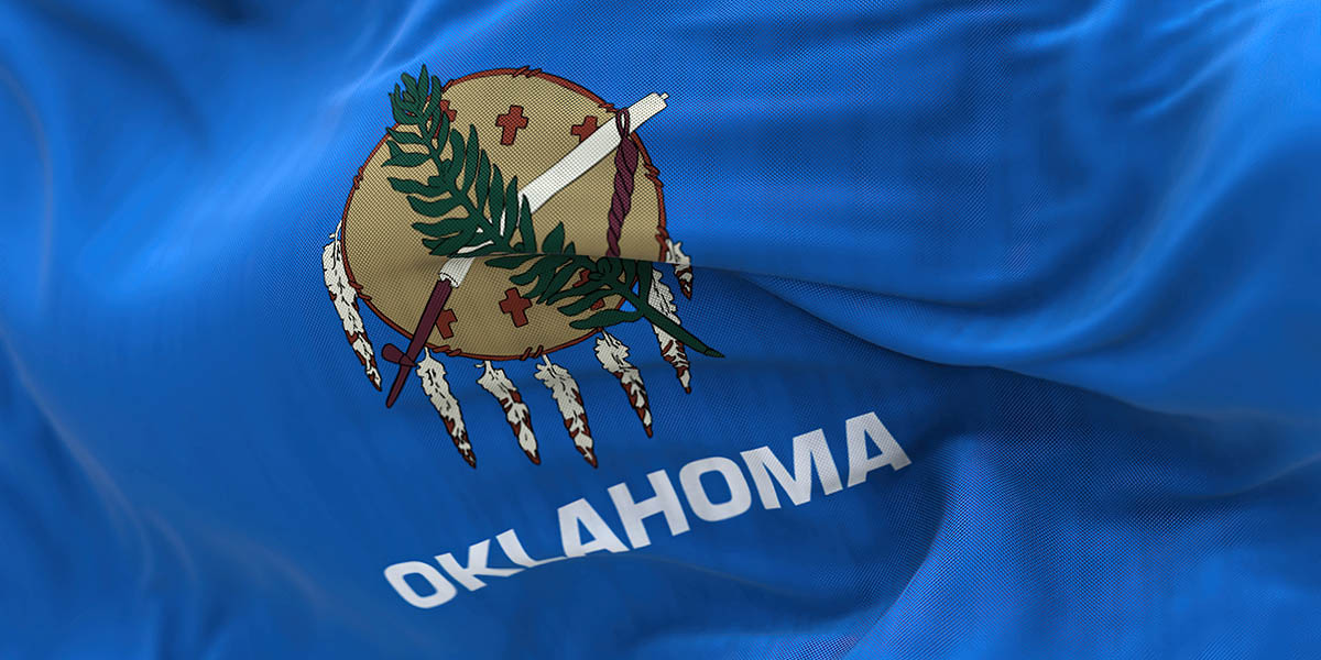 Close up view of the Oklahoma state flag waving.
