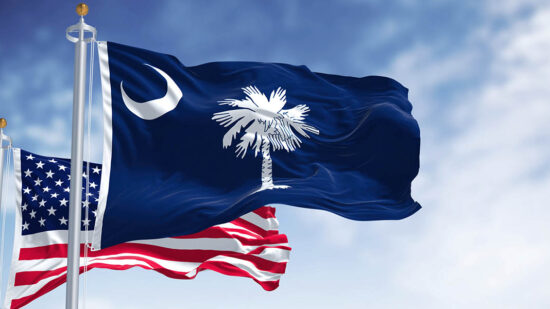 The South Carolina state flag waving along with the national flag of the United States of America